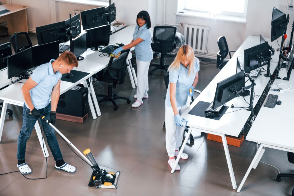 Professional cleaner performing deep office cleaning versus ongoing janitorial maintenance